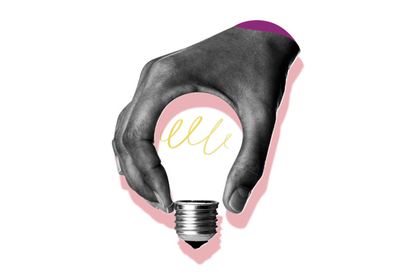 Hand holding a lightbulb