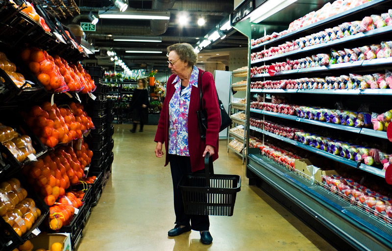 Senior citizen browses groceries
